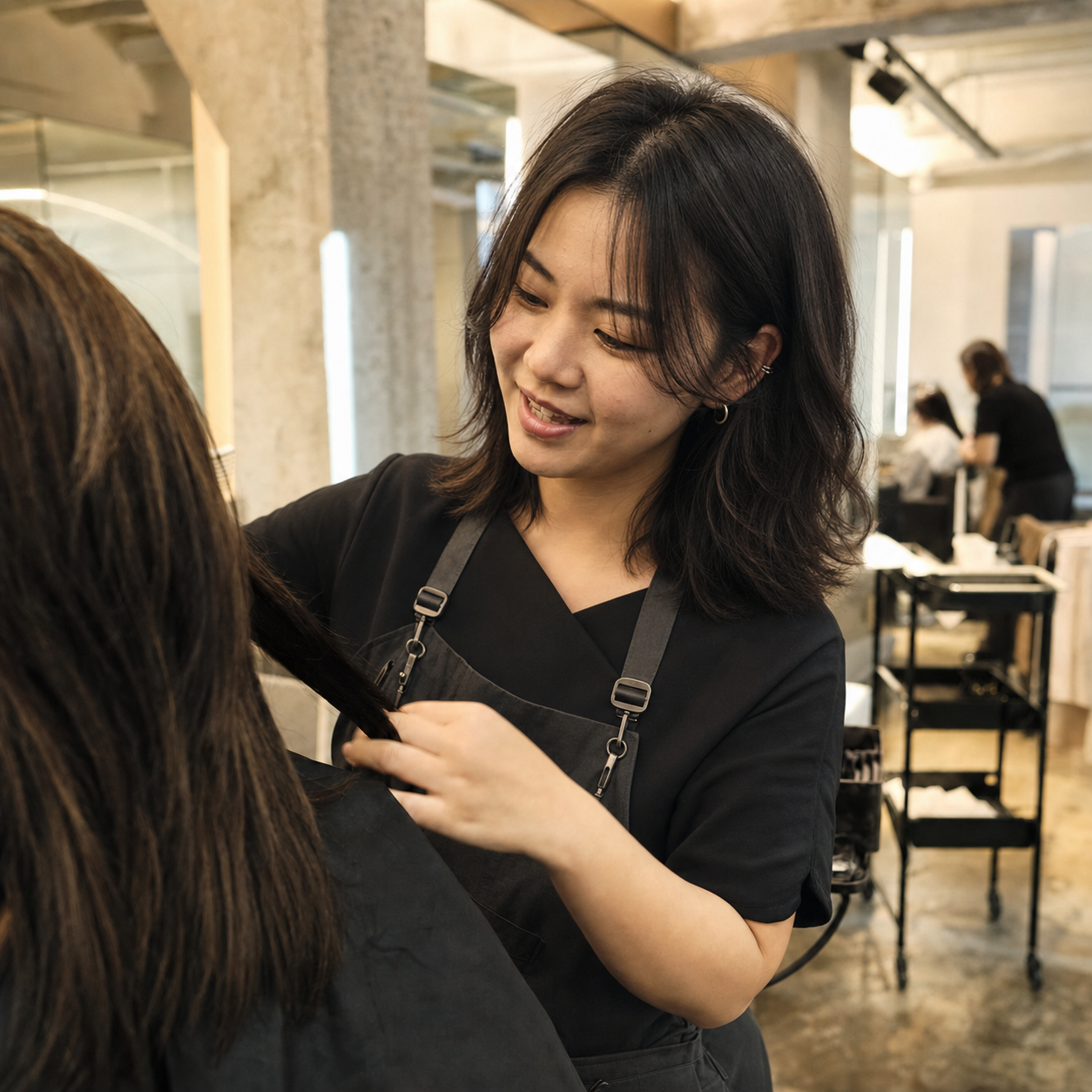 Ayla, Veraé lead stylist, working with a salon client